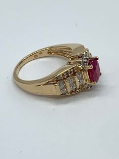 Classic Ruby Ring With Halo Design, Elegant Lab-created Ruby Diamond Ring For Anniversary, Classic 14k Gold Ruby Ring With Halo Design, Classic Ruby Halo Ring, Classic Halo Setting Jewelry With Lab-created Ruby, Classic Halo Ruby Promise Ring, Elegant Vvs Clarity Ruby Ring For Anniversary, Classic Diamond Ring With Halo Setting And Lab-created Ruby, Elegant Ruby Ring With Vvs Clarity For Anniversary