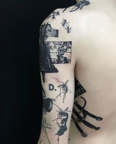 the back of a person's arm with tattoos on it