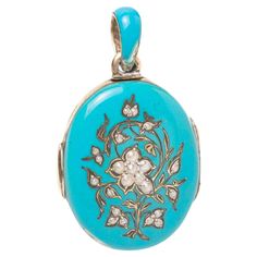 A 19th century Austrian-Hungarian silver and blue enamel oval locket with forget me not motif. The front of the piece depicting beautiful floral composition made with a 'forget me not ' flower in the centre set with natural seed pearls and a silver gilt decoration. The blue enamel and the forget me not flower both underline the meaning 'forget me not' which is eternal love and faithfulness. Inside is silver gilt compartments with two glazed sections for photographs. Hallmarks inside of the locke Pearl Locket, Art Nouveau Ring, Floral Composition, Forget Me Not Flower, Oval Locket, Leather Box, Seed Pearl, Forget Me Not, Beauty Art