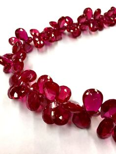 GEMSTONE    - RUBY CORUNDUM SHAPE             - PEAR FACETED SIZE                 - 7-9 mm WIDTH SIZE                 - 10-12 mm LONG LENGTH          - 18 INCH LONG STRAND QUALITY         - AAA BEAUTIFUL PEAR DROP NECKLACE HARDNESS STONE WHOLESALE SHOP If you have any questions about this item please contact me I will get back to you as soon as. We accept bulk or wholesale orders for any gemstone which you'll get best wholesale prices! Hence you can contact me with your requirement of bulk or wh Gemstone Beads Jewelry, Ruby Beads, Beading Ideas, Red Gemstones, Expensive Jewelry, Teardrop Beads, Drop Beads, Emerald Jewelry, Ruby Gemstone