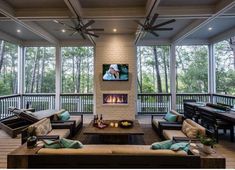 a living room filled with furniture and a fire place