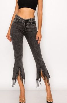 These trendy and fun denim pants are the perfect combination of style and comfort! Sparkling with rhinestones and flirty fringe, you'll make heads turn with their unique raw hem and classic 5 pocket design. Plus, they've got a zip and button closure, plus belt loops to boot, so you'll be ready to rock 'n' roll in no time! 1365P High Waist Stretch Cropped Jeans With Frayed Hem, Stretch Flare Pants With Frayed Hem, Trendy Stretch Jeans With Frayed Hem, Fall Denim Pants With Frayed Hem, Trendy Stretch Bottoms With Frayed Hem, Cropped Stretch Pants With Frayed Hem, Mid-rise Pants With Frayed Hem For Fall, Stretch Pants With Cropped Leg And Frayed Hem, Stretch Cropped Pants With Frayed Hem