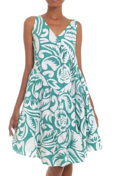 Silk screen blossoms evoke the tropics with voluptuous waves in green on white. By Hari and Arthur this delightful sun dress features diagonal ruffles that swirl around the body. Its V-neck and easy fit make this design a classic. Tropical White Printed Dress, White Tropical Printed Dress, Green Floral Print Tropical Sundress, Tropical Green Floral Print Sundress, Green Tropical Floral Print Sundress, Green Tropical Sundress With Floral Print, Casual White Hibiscus Print Dress, Spring Hawaiian Green Dresses, Green Hawaiian Floral Print Dress