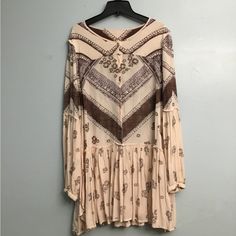 Women’s Cream And Brown Floral Free People Small Long Sleeve Dress! Brand New And Has Not Been Worn. It Is Perfect Lightweight For The Spring And Summer Time Weather! Dr52 Beige Long Sleeve Boho Dress For Spring, Casual Beige Long Sleeve Boho Dress, Flowy Beige Boho Dress For Fall, Cream Bohemian Flowy Mini Dress, Beige Tunic Dress For Fall, Flowy Cream Bohemian Mini Dress, Beige Long Sleeve Dress With Boho Print, Beige Long Sleeve Boho Print Dress, Beige Boho Dress With Print For Fall