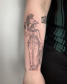 a woman with a tattoo on her arm