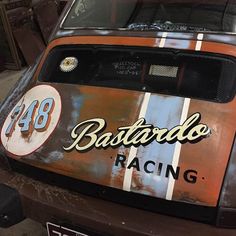 an old race car with the word batarabo racing painted on it's side