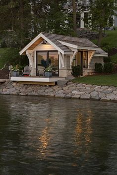 a small house sitting on top of a lake