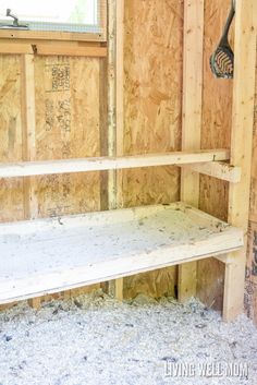 the inside of a building with wooden walls and shelving in place for insulation to be installed