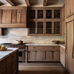 12 Oak Kitchen Cabinets You Will Love Darker Stained Kitchen Cabinets, Antique Oak Kitchen Cabinets, Countertop Ideas For Wood Cabinets, Unfinished Wood Cabinets, Dark Stained Oak Cabinets, Different Types Of Wood Cabinets, Dark Oak Stained Kitchen Cabinets, Provincial Stain Cabinets, Wood Cabinets Grey Countertop