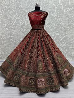 This stunning maroon color velvet bridal lehenga, exquisitely crafted to make you shine on your special day. The richness of the velvet material combined with intricate details such as multi-thread work, sequin work, diamond work, zari work, embroidered work, hand mirror work, and fancy dori work, ensures a masterpiece that epitomizes luxury and grace. The attention to detail in every stitch and embellishment speaks volumes about the craftsmanship that went into creating this ensemble.
Paired wi Reception Velvet Choli With Intricate Embroidery, Velvet Choli With Intricate Embroidery For Reception, Designer Semi-stitched Velvet Lehenga, Velvet Choli With Resham Embroidery For Reception, Anarkali Wedding Velvet Lehenga, Anarkali Velvet Lehenga For Wedding, Semi-stitched Velvet Lehenga For Reception, Velvet Lehenga With Traditional Drape For Wedding, Festive Semi-stitched Heavy Lehenga