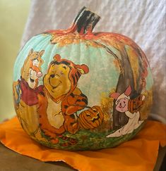 a winnie the pooh pumpkin sitting on top of a table