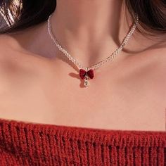 A dainty choker with a pearl bead, striking red bow, a teardrop tiny zircon dangling, sweet and festive feel - perfect for the holidays, parties, or dinners, and easy to match any look! ----------- DESCRIPTIONS ----------- - Materials: Faux Pearl, Velvet, CZ - Length: 43cm - SKU: E1688 Elegant Christmas Party Necklaces, Cute Red Necklace For Parties, Elegant Jewelry With Red Bow For Gifting, Valentine's Day Party Bow Jewelry, Valentine's Day Jewelry With Red Bow, Valentine's Day Party Jewelry With Red Bow, Elegant Red Jewelry With Bow, Bow Choker, Dainty Choker