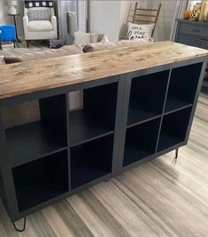 a large wooden table sitting on top of a hard wood floor