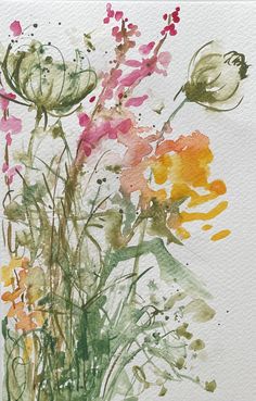 a watercolor painting of flowers on a white paper with green and pink inks