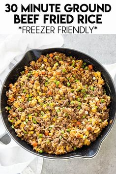 a skillet filled with ground beef and vegetables on top of a white tablecloth