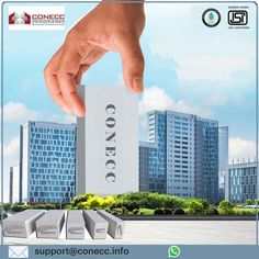 a hand holding up a business card in front of a cityscape with skyscrapers