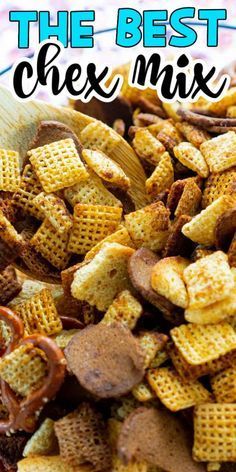 the best chex mix is in a bowl with a wooden spoon