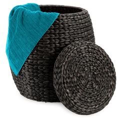 two round baskets with blue towels on top and one in the middle, sitting next to each other