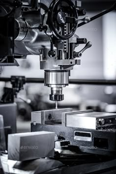 a machine that is working on something in black and white - stock photo - images