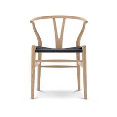 the wish chair in natural oak and white wicker is upholstered with an oatmeal finish