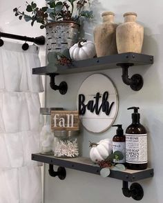 two shelves with bottles and soaps on them