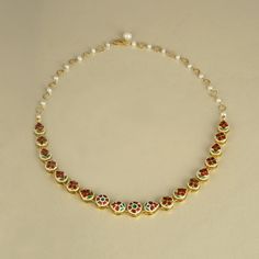 Gold(22k) : 4.36gGold(18k) : 13.71gUncut Diamond/Vilandi/Polki: 3.50ctGemstone : Cultured PearlsOther.: Green Enamel, White Enamel, Red Enamel Yellow Gold Kundan Necklace With Gemstone, Formal Round Temple Necklace With Meenakari, Uncut Diamond Necklace, Festival Necklace, Tanzanite Earrings, Ruby Bracelet, Princess Necklace, Polki Necklace, Emerald Bracelet