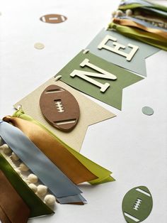 a football themed banner on a table with paper streamers and other items around it