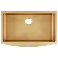 an image of a gold kitchen sink on a white background with a circular hole in the middle