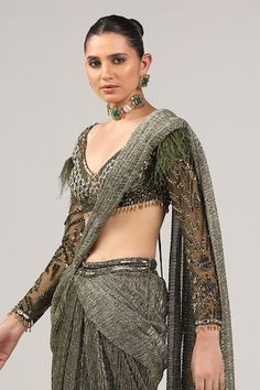 Olive green pre-draped six yard textured saree with hand embroidered waistband. Paired with a padded blouse with hand embroidery work using feathers, mirrors and sequins. - Aza Fashions Saree Gowns, Dhoti Saree, Cotton Sarees Handloom, Green Feathers, Hand Embroidery Work, Ruffle Saree, Padded Blouse, Drape Saree, Green Saree