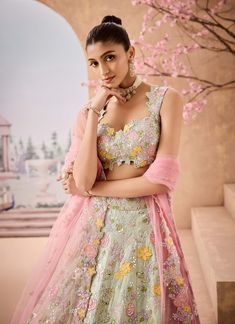 Introducing a delicate mint lehenga adorned with exquisite 3d handcrafted embroidered flowers. Embellished with sequins, mirrors, thread, and badla work, this ensemble radiates charm and sophistication. Paired with a soft pink dupatta, it’s the perfect choice for those seeking a graceful look for special occasions. Mint Lehenga, Badla Work, Pink Dupatta, Embroidered Lehenga, Silk Organza, Indian Design, Indian Outfits, Embroidered Flowers, Every Woman