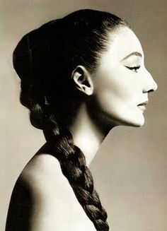 black and white photograph of a woman's face with her hair in a braid