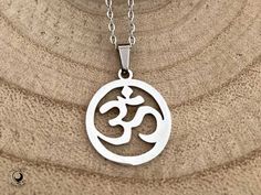 Om Necklace Om or Aum is the sound of a sacred spiritual symbol that symbolizes the sound of the universe and eternal bliss. The Om sound is a short seed mantra which is chanted to connect with and energize the chakras. It also gives enrichment to yoga and meditation practices. * Stainless Steel Charm 2cm x 1.8cm * Stainless Steel Necklace 45cm long including lobster clasp * Lobster clasp * Tarnish resistant * Hipoallergenic * Statement jewellery * Perfect for Layering with other Necklaces * Per Symbolic Necklaces For Meditation And Festivals, Om Sound, Om Earrings, Om Necklace, Spiritual Symbols, Yoga And Meditation, Les Chakras, Statement Jewellery, Meditation Practices