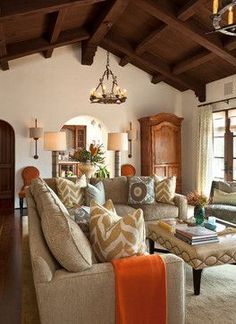 a living room filled with furniture and lots of windows