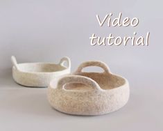 two white baskets sitting next to each other with the words video tutor written above them