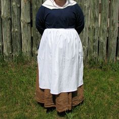 "This 18th century apron is a must for any historical program, historical interpretation or your next visit to WIlliamsburg. The apron was one of the basic garments for all colonial women and girls. Aprons were worn to protect their clothing from the daily soiling from everyday living. This apron can be made with either a drawstring waist or a fitted waistband (pictured). Both are accurate, what you choose is a personal preference. I just need your waist measurement. I cut these 30\" long, but c 18th Century Apron, Pioneer Clothing, Cindy Smith, Colonial Dress, I Just Need You, 18th Century Fashion, Cotton Apron, Happy Women, Women's Costumes