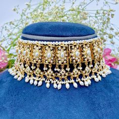 Featuring a classic broad pearl choker necklace matched with a magnificient pair of edwardian era style earrings, made in sterling silver with 22K gold plating. Ideal for wedding functions and will go with any south asian attire. It has been embellished with freshwater pearls. Weight - 110 GMs for the full set with earrings weighing 30gms Default Materials in Our Gold Plated Jewellery Metal: 925 Sterling Silver Studded Stones: Precious freshwater pearls, synthetic red,green,blue stones that rese Elegant Gold Plated Kundan Necklace For Ceremonial Occasions, Ceremonial Gold Pearl Bridal Necklace, Elegant Pearl Necklace With Tilla As A Gift, Luxury Gold Pearl Necklace For Wedding, Elegant Tilla Pearl Necklace Gift, Elegant Kundan Necklace With Intricate Design For Ceremonies, Elegant Kundan Necklace With Intricate Design For Ceremonial Occasions, Ceremonial Gold Pearl Necklace, Gold Pearl Necklace For Ceremonial Occasions