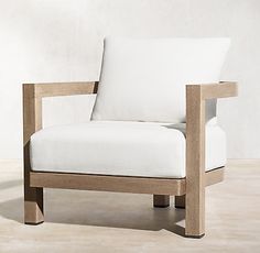 a white chair sitting on top of a wooden floor