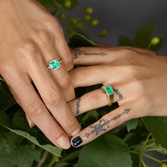 This remarkable ring showcases a 2.34-carat emerald set in 18K yellow gold and complemented by brown diamonds. These ancient gemstones, adored by Queen Cleopatra, are celebrated for their lush green color. Satomi meticulously selects each stone for its distinctive beauty and scarcity, ensuring every piece is original. Our NYC studio carefully crafts every piece, adding a touch of uniqueness to our designs. Please note that this ring can only be resized ±1.5 sizes from its original size. Fine Jewelry Emerald Ring With Gemstone Accents, Gold Emerald Cut Ring With Gemstone Accents, Queen Cleopatra, Emerald Set, Brown Diamonds, Emerald And Diamond Ring, Nyc Studio, Brown Diamond, Emerald Ring