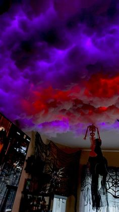 purple and red clouds are painted on the ceiling