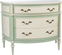 a white and green dresser with two drawers on each side, one drawer has three handles