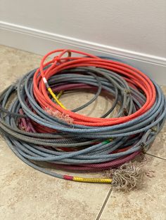 several different colored wires laying on the floor