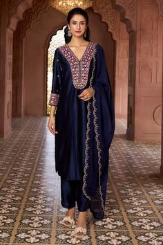 Navy blue kurta with contrasting sequin, thread and floral embroidery. Comes with scalloped hem dupatta and solid pant. - Aza Fashions Blue Chinon Kurta With Intricate Embroidery, Blue Silk Palazzo Set With Intricate Embroidery, Blue Palazzo Set With Intricate Embroidery In Chanderi, Blue Chanderi Palazzo Set With Intricate Embroidery, Blue Raw Silk Dupatta With Mirror Work, Blue Dola Silk Kurta With Mirror Work, Blue Raw Silk Salwar Kameez With Mirror Work, Blue Raw Silk Palazzo Set With Mirror Work, Blue Raw Silk Traditional Wear With Mirror Work