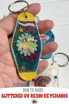 a hand holding a keychain with an image of a woman on it and the words how to make glittered resin key chains