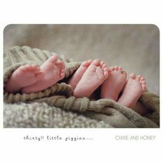 a baby's feet are wrapped in a blanket