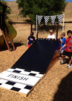 some kids are playing with a giant inflatable board