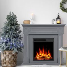 a living room with a fire place and christmas decorations on the fireplace mantels