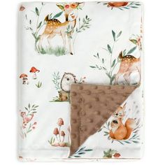 a blanket with deers and mushrooms on it, in front of a white background