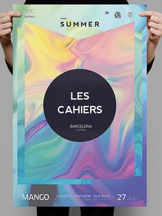 a person holding up a poster with the words les cahiers on it