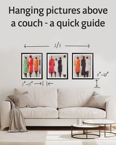 Three frames hung above a couch with measurements. The pictures should be around 2/3 the length of the couch, hung 8-10 inches above a couch, and spaces 2-5 inches apart. Hang Pictures Above Couch, What To Hang On Wall Behind Couch, Ideas For The Wall Behind The Couch, How To Hang Art Above The Sofa, Wall Next To Couch Decor, Wall Art Behind Sectional Couch, Gallery Wall Above Sectional, Picture Frame Behind Couch, Art Over Sectional Sofa Living Rooms