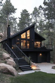 a black house with stairs leading up to it